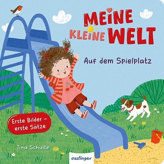 Das Buchcover zeigt ein fröhliches, rot gekleidetes Mädchen mit lockigem, braunem Haar, das von einer Rutsche ins Gras rutscht. Im Hintergrund sind ein Hund und bunte Spielplatz-Elemente zu sehen.