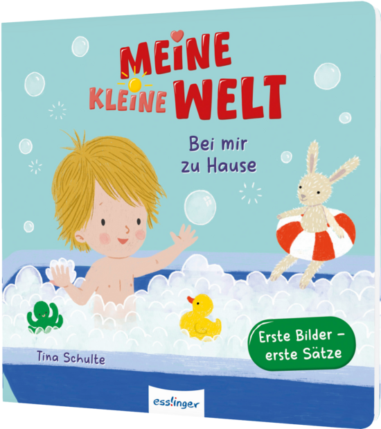 Das Buchcover zeigt einen fröhlichen Jungen mit blonden Haaren in einer Badewanne voller Schaum. Neben ihm schwimmen ein gelbes Gummibärchen und ein weißes Kaninchen mit einem roten Schwimmring.