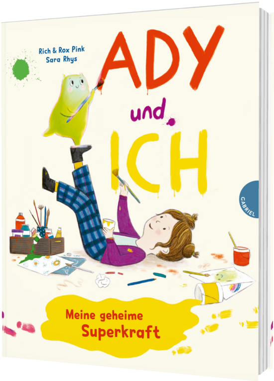 Das Buchcover zeigt … ein Mädchen auf dem Rücken mit karierter blauer Hose und lila Pullover, pinselnd, daneben ein grünes Wesen und bunte Farbtupfer.